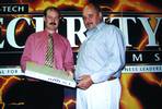 Jim Perkins of Dedicated Micros presents Jeff Groenewald of Basix Technologies with the latest Digital Sprite Lite